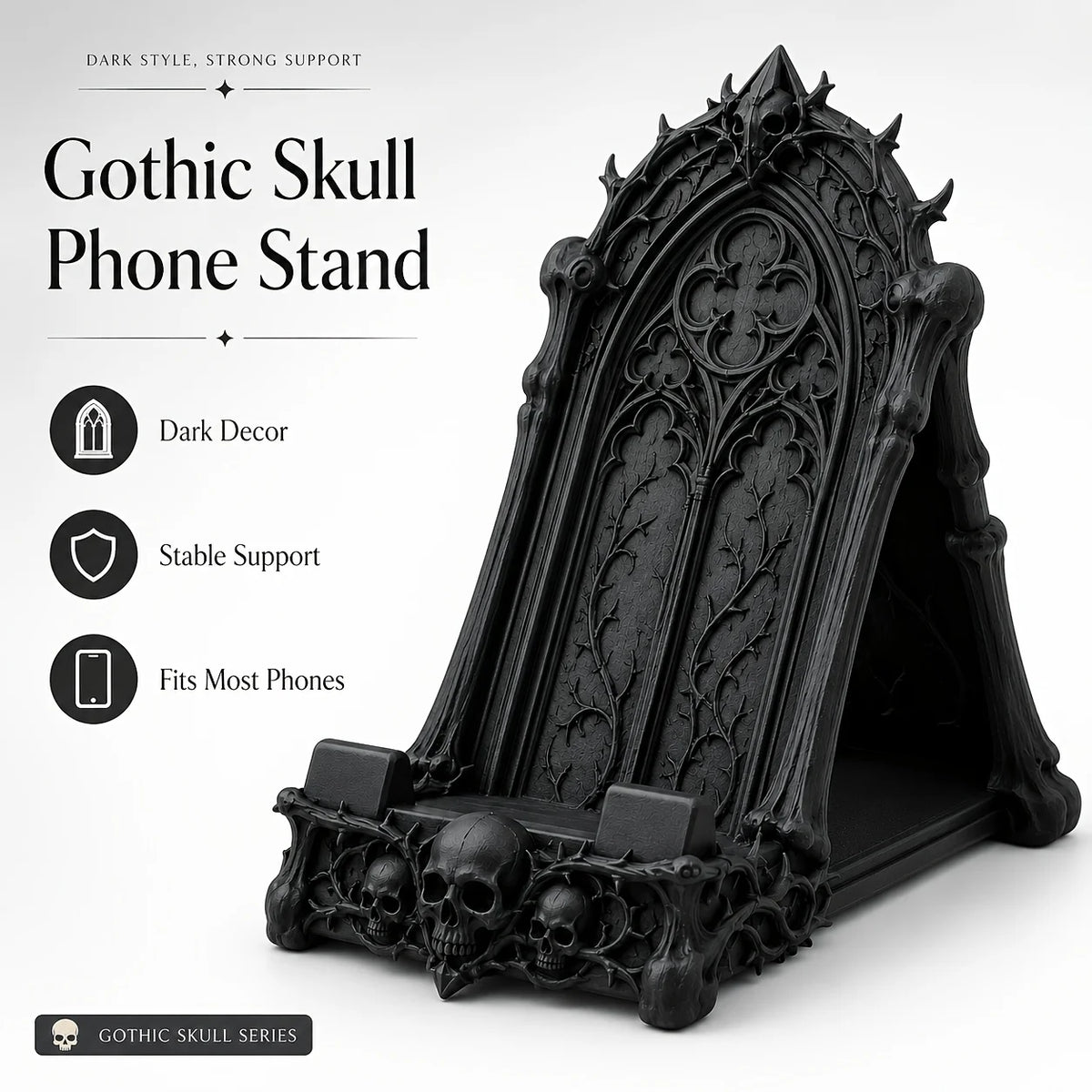 A black Gothic skull phone stand with intricate carvings and a decorative frame.