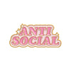 Pink enamel pin featuring the text ANTI SOCIAL in a decorative, rounded font.