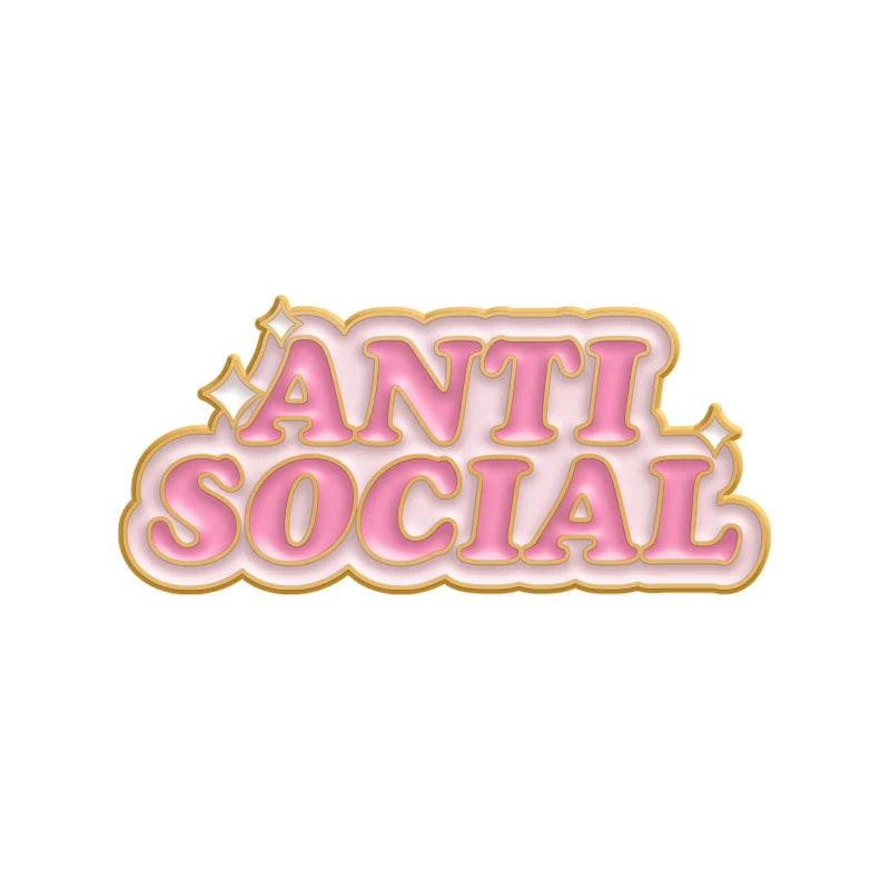 Pink enamel pin featuring the text ANTI SOCIAL in a decorative, rounded font.