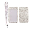 A white marble-patterned key lanyard and a matching rectangular ID badge holder.