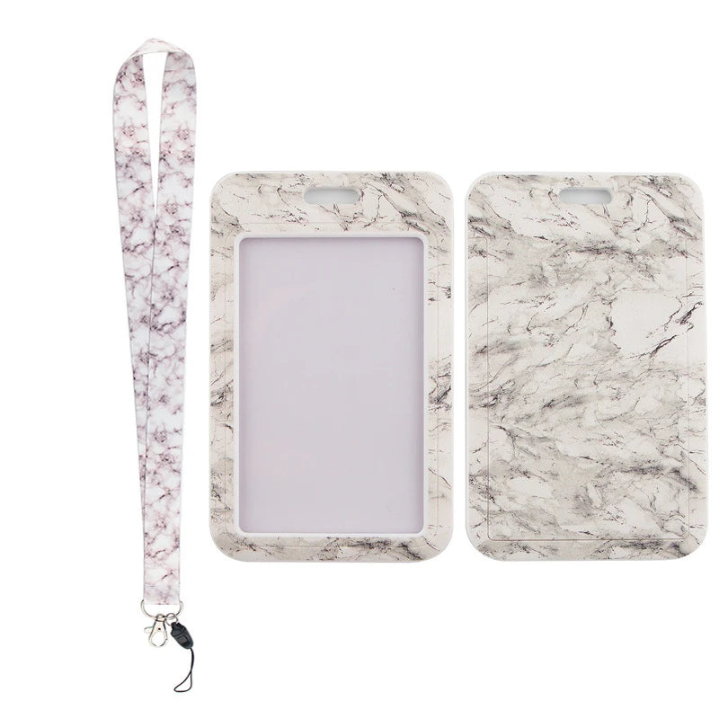A white marble-patterned key lanyard and a matching rectangular ID badge holder.