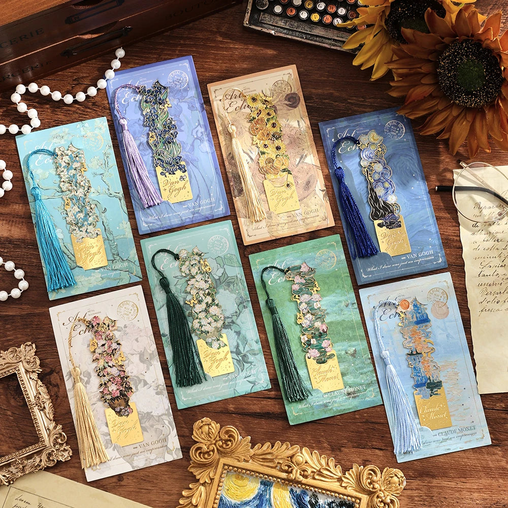 A collection of vintage artistic metal bookmarks featuring various colors, textures, and tassels on a wooden surface.
