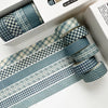 A set of blue plaid washi tape rolls featuring grid and polka dot patterns displayed in a white box.