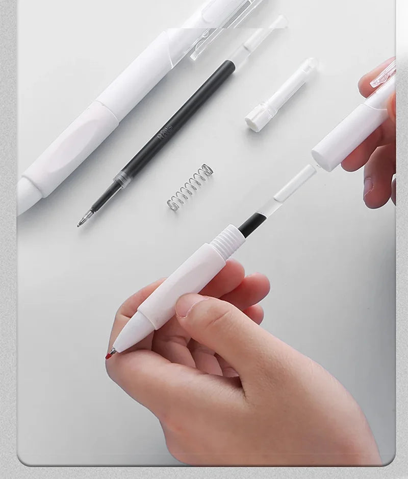A hand holds a white gel pen with black ink and a spiral refill, demonstrating the smooth writing experience.