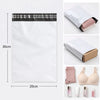 White self-adhesive courier mailer bags with black tape and pink tissue paper inside