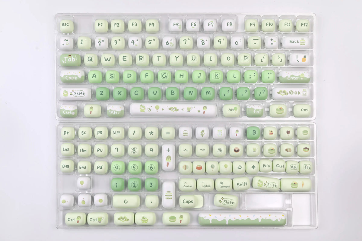 A clear plastic keyboard featuring a colorful PBT keycaps set with MOG profile and dye-sub cherry compatibility.