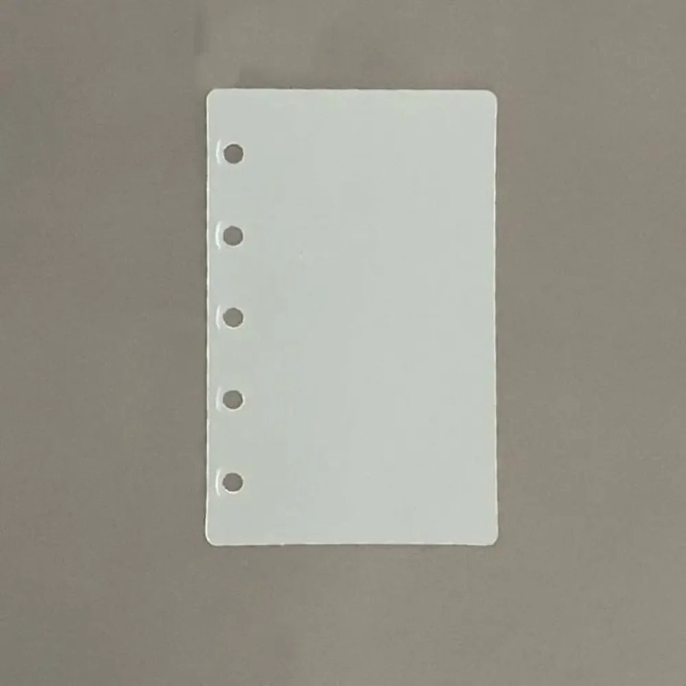 A white divider page with punched holes for loose-leaf planners.