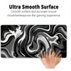 A black and white liquid wave design gaming mouse pad being touched by a hand.