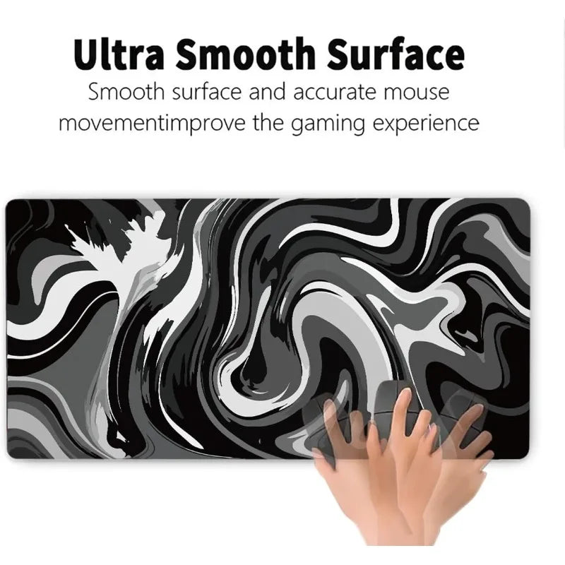 A black and white liquid wave design gaming mouse pad being touched by a hand.