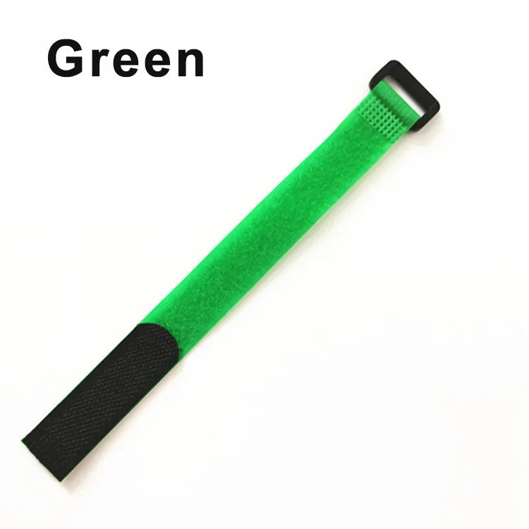 A green reusable hook and loop cable tie with a black sleeve.