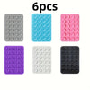 Six silicone suction phone mounts in various colors including gray, blue, pink, purple, white, and black.