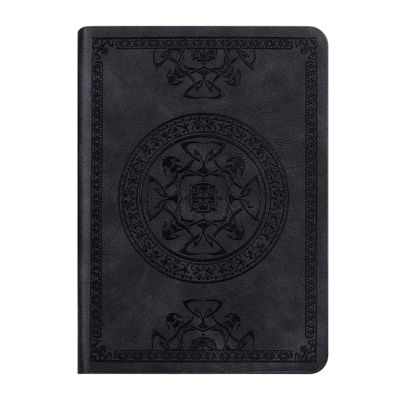 A black retro PU leather pocket notebook with embossed decorative patterns on the cover.