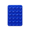 Soporte para teléfono de silicona azul con ventosas y orificios circulares para fijar dispositivos.