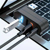 A black USB hub with four ports is shown connected to a laptop keyboard and mouse.