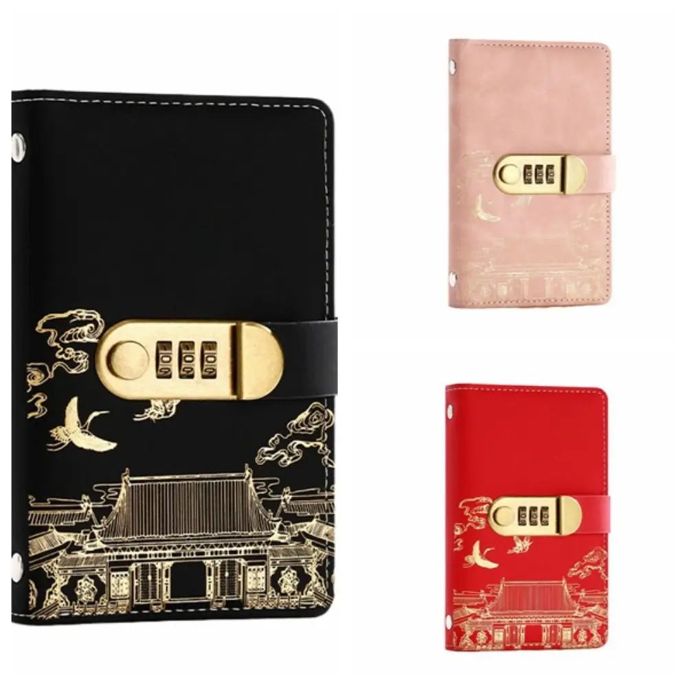 A black personal finance budget binder with a gold lock and decorative Japanese-style pattern.