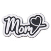 A black and white die-cut charm shaped like the word Mom with a heart design.