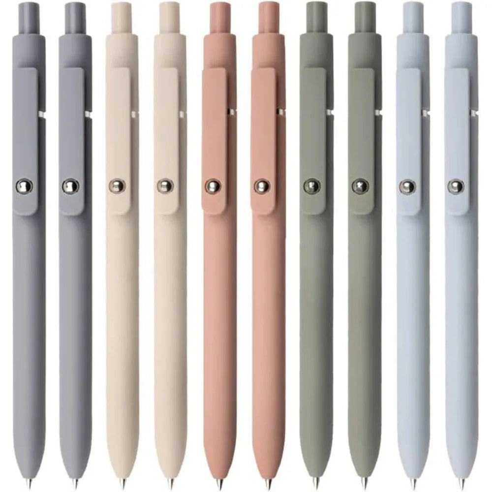 A collection of smooth fine tip gel pens in various shades of gray and pink