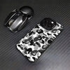 A black iPhone case featuring a leopard print camouflage pattern is shown next to a black Apple AirPods case.