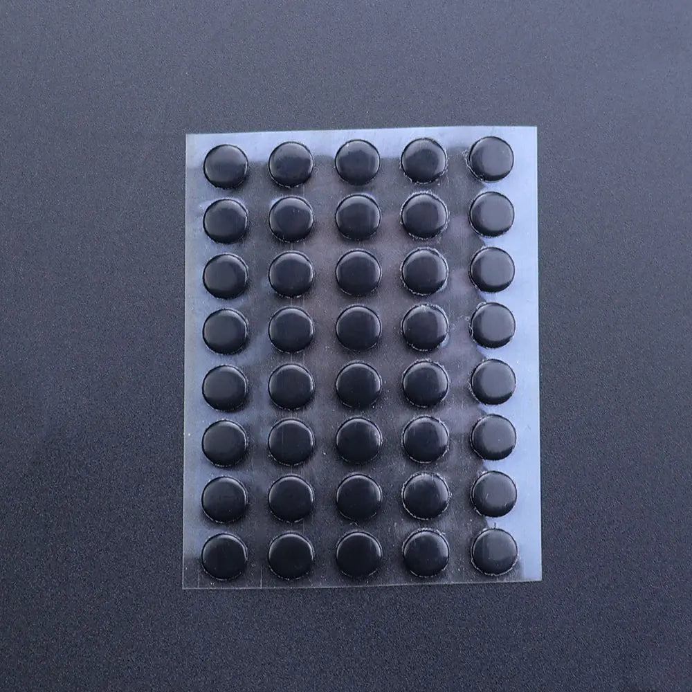 A rectangular sheet of 40 adhesive glide feet for universal mouse skates, arranged in a grid.