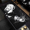 A black mouse pad featuring an illustration of a female character with white hair and a black dress, surrounded by spiderweb 
