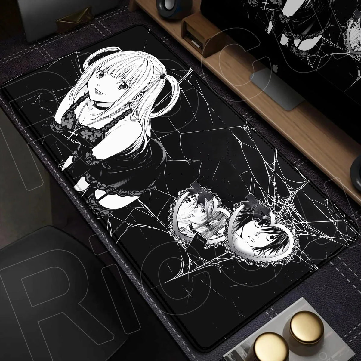 A black mouse pad featuring an illustration of a female character with white hair and a black dress, surrounded by spiderweb 