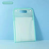 A transparent green portable accordion document organizer lying on a light blue surface.