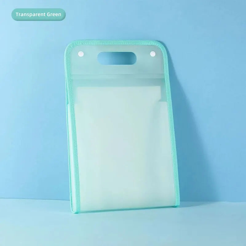 A transparent green portable accordion document organizer lying on a light blue surface.