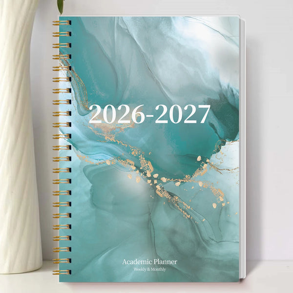 A spiral-bound academic planner cover featuring a teal and white marbled design with gold accents and the text 2026-2027