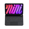 Estuche de teclado mágico con iluminación púrpura y rosa para iPad Mini.