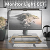 A modern monitor light bar is mounted above a computer monitor, illuminating the screen with soft light.
