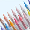 A collection of soft acrylic paint markers in various shades of pink, purple, blue, and yellow, shown in a row.