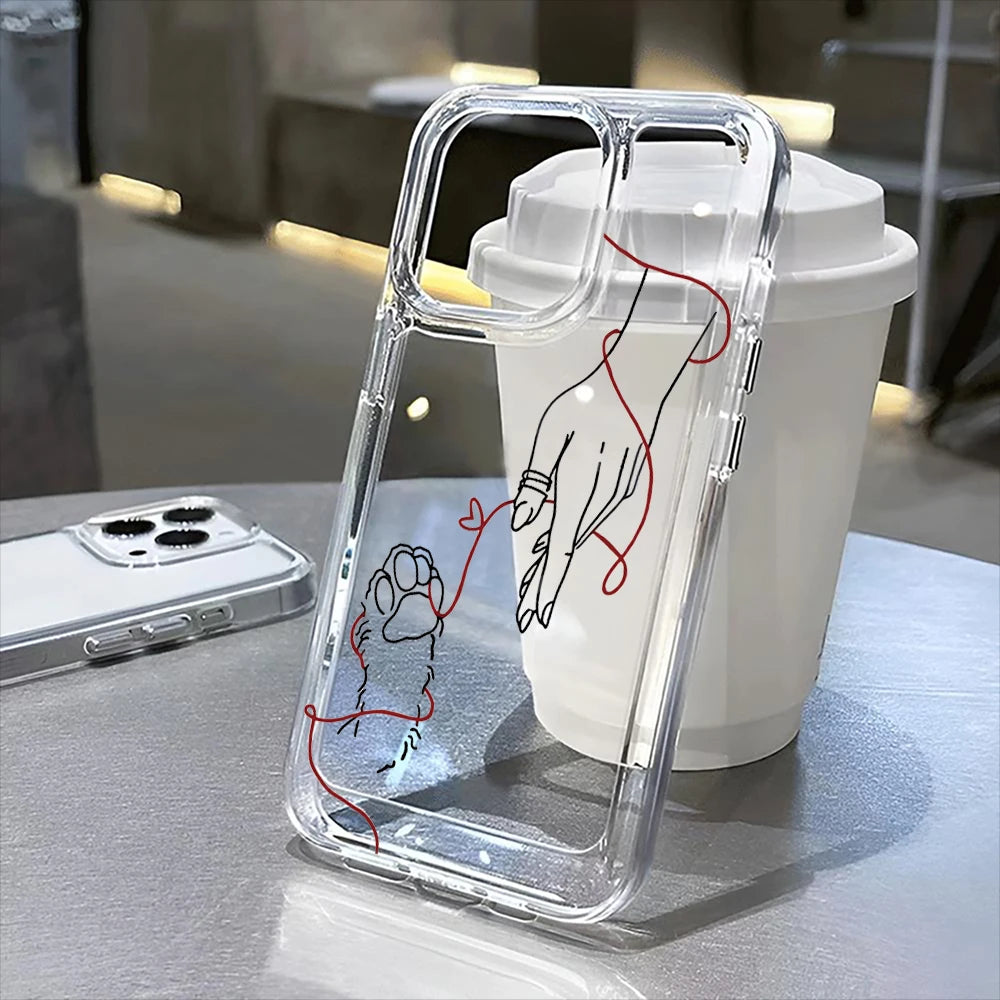 A clear plastic phone case with a floral pattern is shown resting on a light surface.