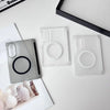 Clear silicone phone cases and a black case displayed on a white surface.