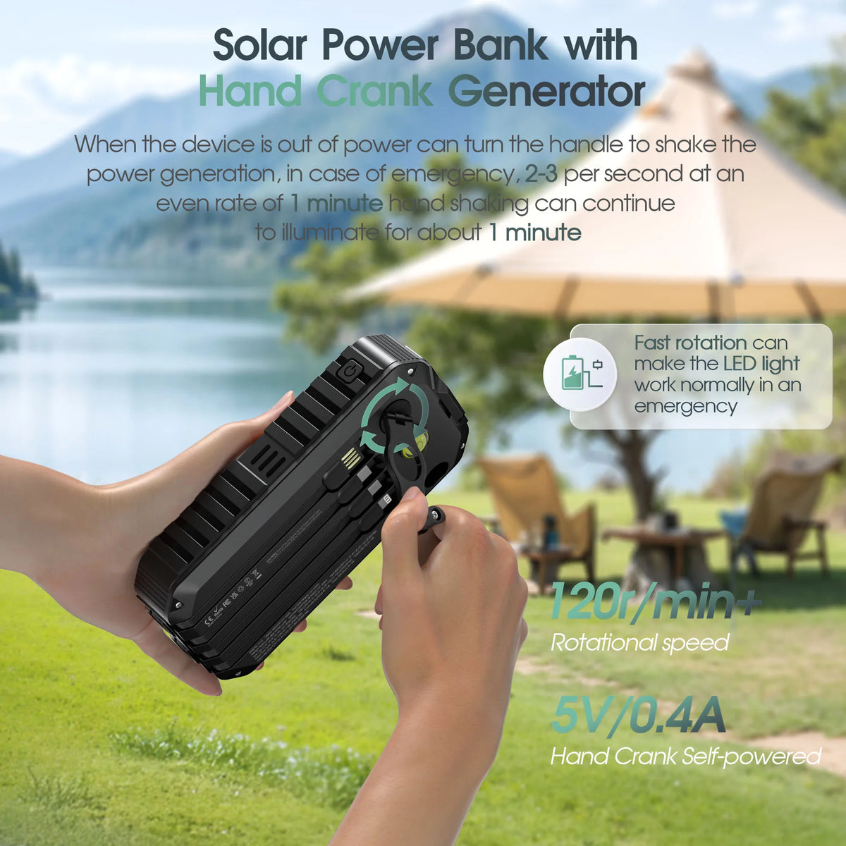A hand is operating a black solar power bank with a hand crank generator outdoors.