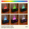 A set of four aroma essential oil diffusers displaying various colors, including red, green, blue, and purple light.