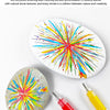 A set of high-gloss acrylic marker pens creating colorful, textured strokes on a white surface.