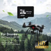 A drone is flying over a green landscape with mountains in the background, featuring a microSD memory card for drones.