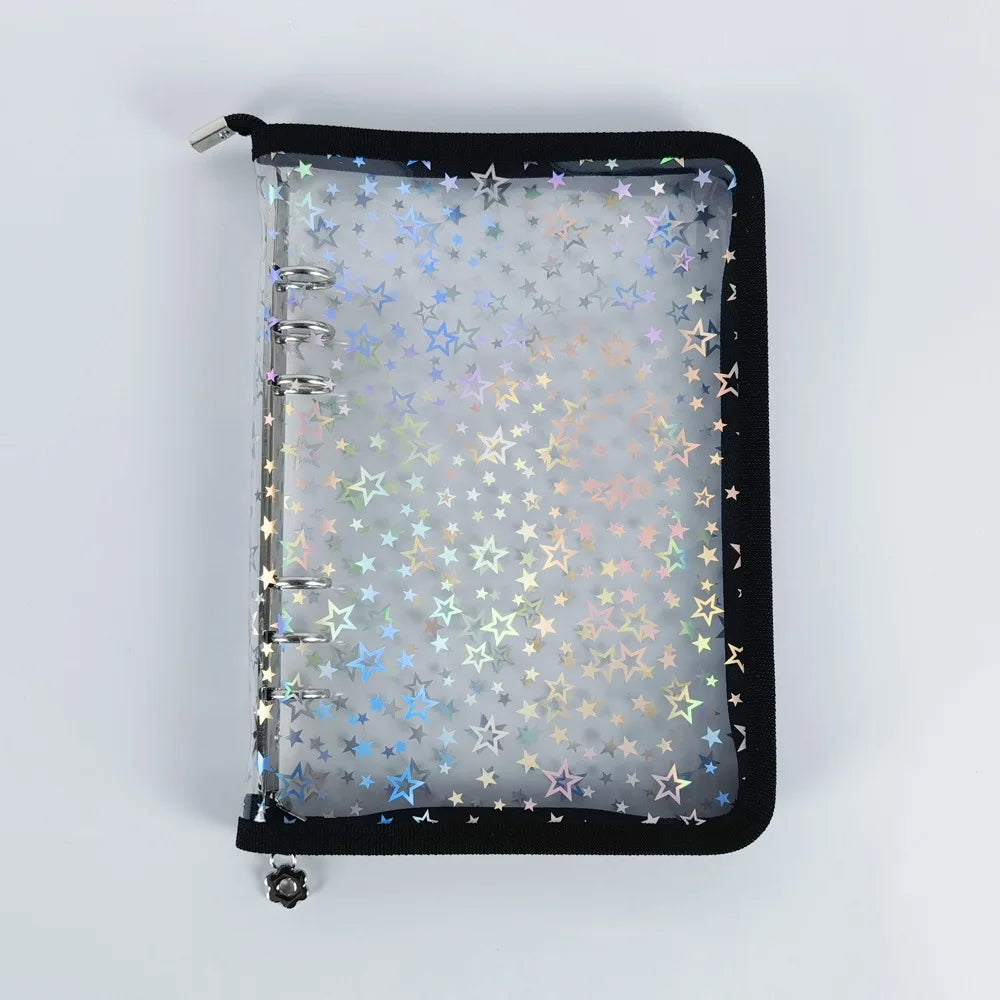 A black A5 sticker organizer binder with clear storage pockets filled with star-shaped stickers.