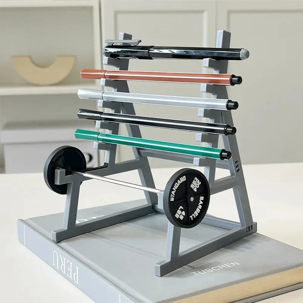 A gray barbell rack organizer holds several black and copper-colored pen holders on a desk.