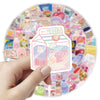A hand holds a square sticker pack featuring K-pop themed cartoon stickers on a colorful background.