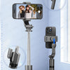 A black versatile selfie stick tripod is shown with a smartphone attached, demonstrating its quick disassembly for shooting.
