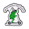 An enamel pin featuring a green frog wearing a witch hat riding a scooter, with text that reads off to commit to foolery.