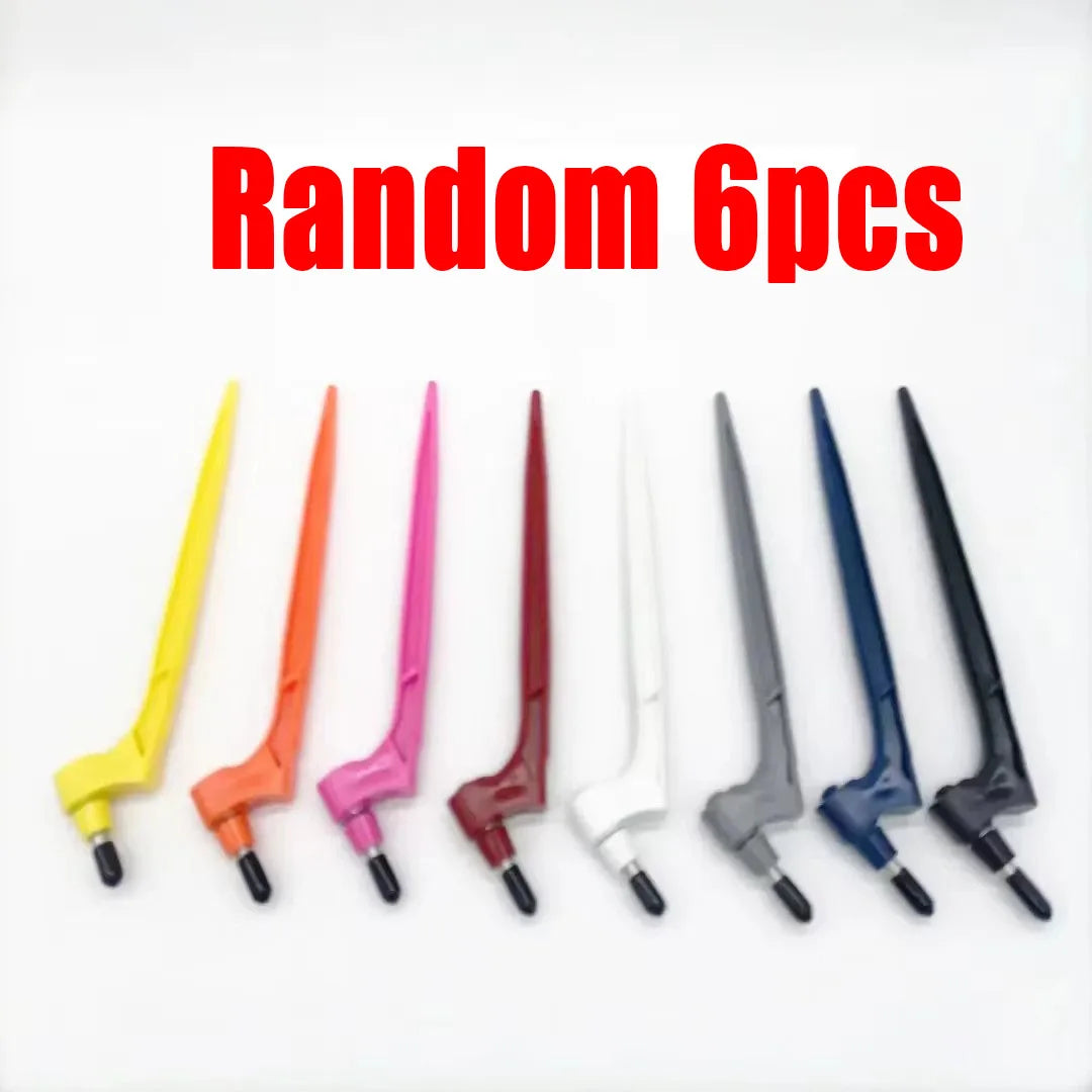 A set of six random steel art cutting tools in various colors and shapes.