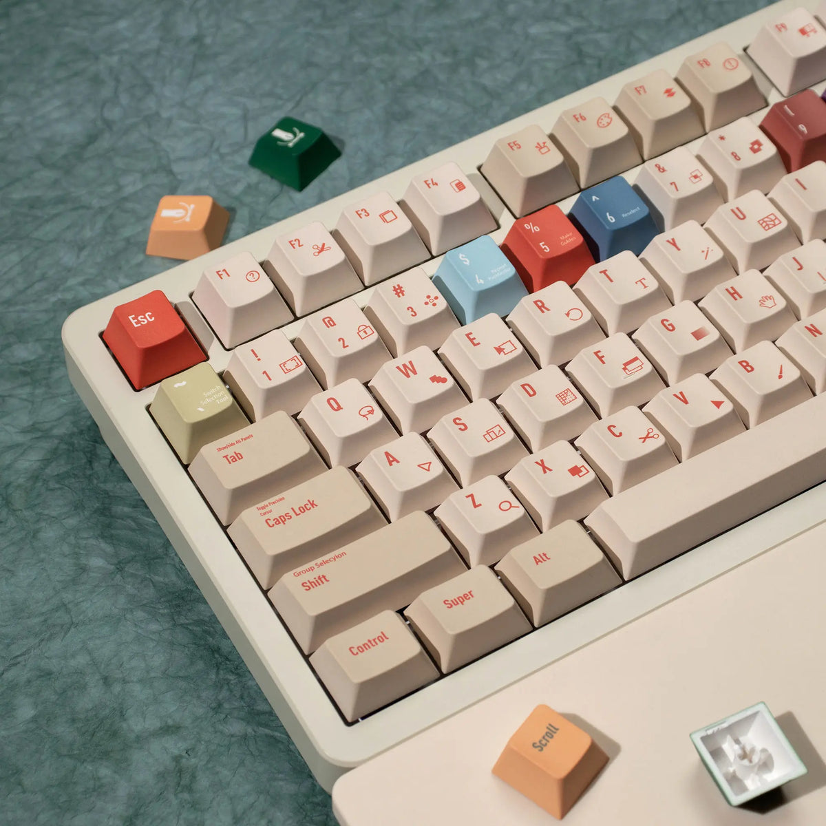 A close-up view of a white mechanical keyboard with retro AI illustrator PBT keycaps in cherry profile and dye-sublimation co