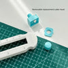 A white adjustable circle cutting tool with a blue replacement cutter head shown on a green cutting mat.