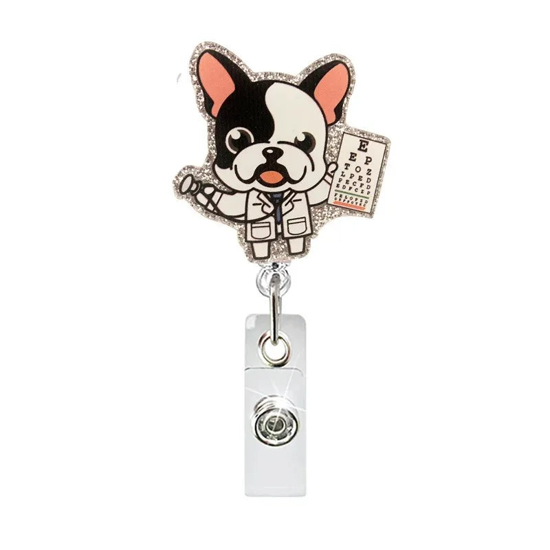 A black and white cat-themed badge reel featuring a cartoon cat design on a silver clip.