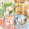 A collection of vintage paper cards and crafting materials including floral elements, for a MO-CARD kit.