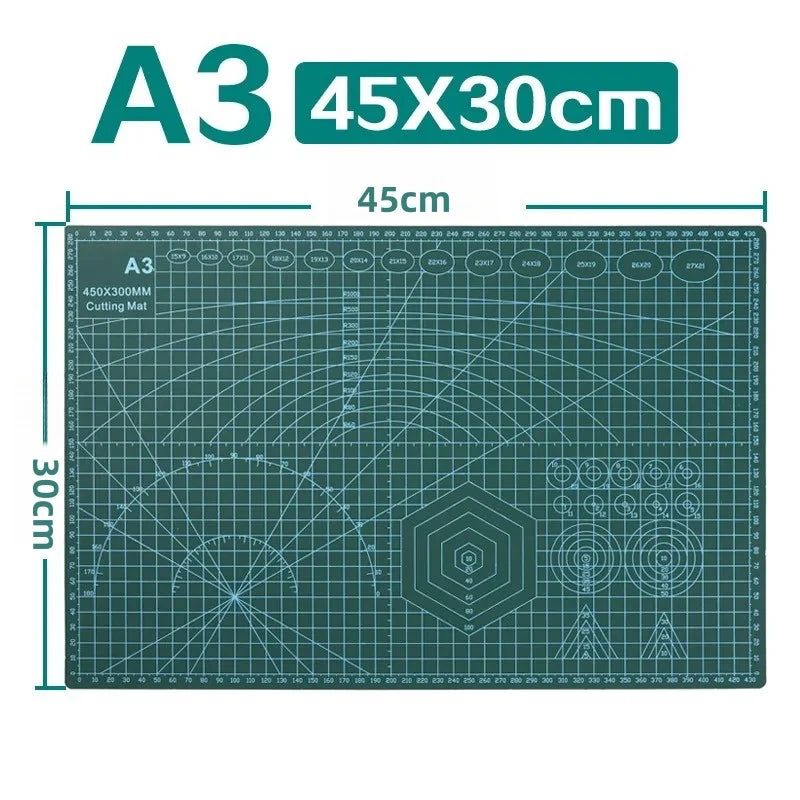 A green A3 cutting mat measuring 45x30cm with grid lines and various crafting symbols.