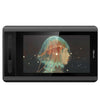 A black digital drawing tablet with an anti-glare screen protector displaying a glowing blue and orange portrait.