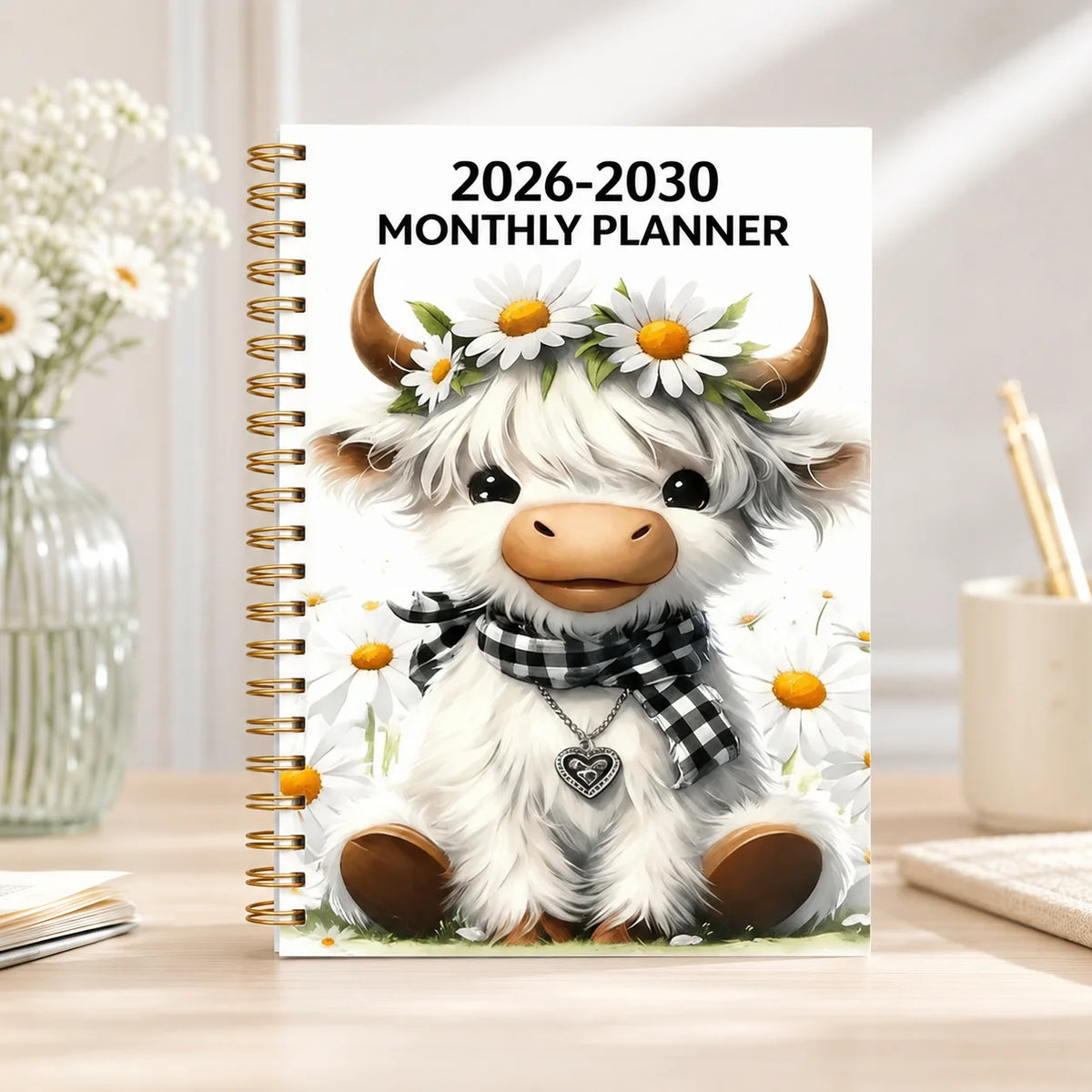 A monthly planner cover featuring a cute white goat with horns and a floral wreath, designed for 2026-2030 planning.